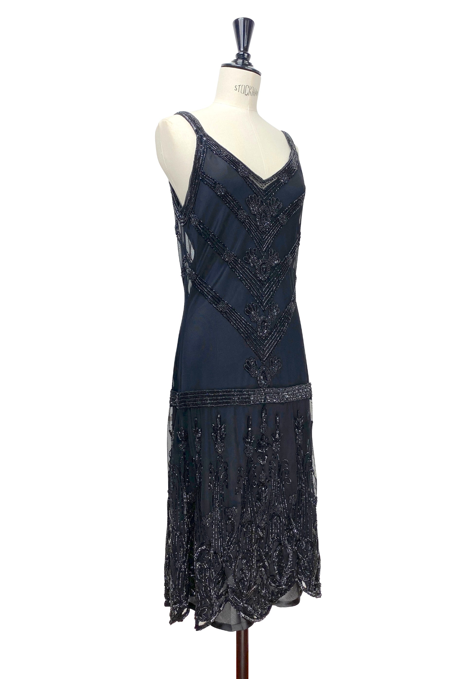 Sleeveless beaded slip dress with V-neck and geometric beading; scalloped fringe hem