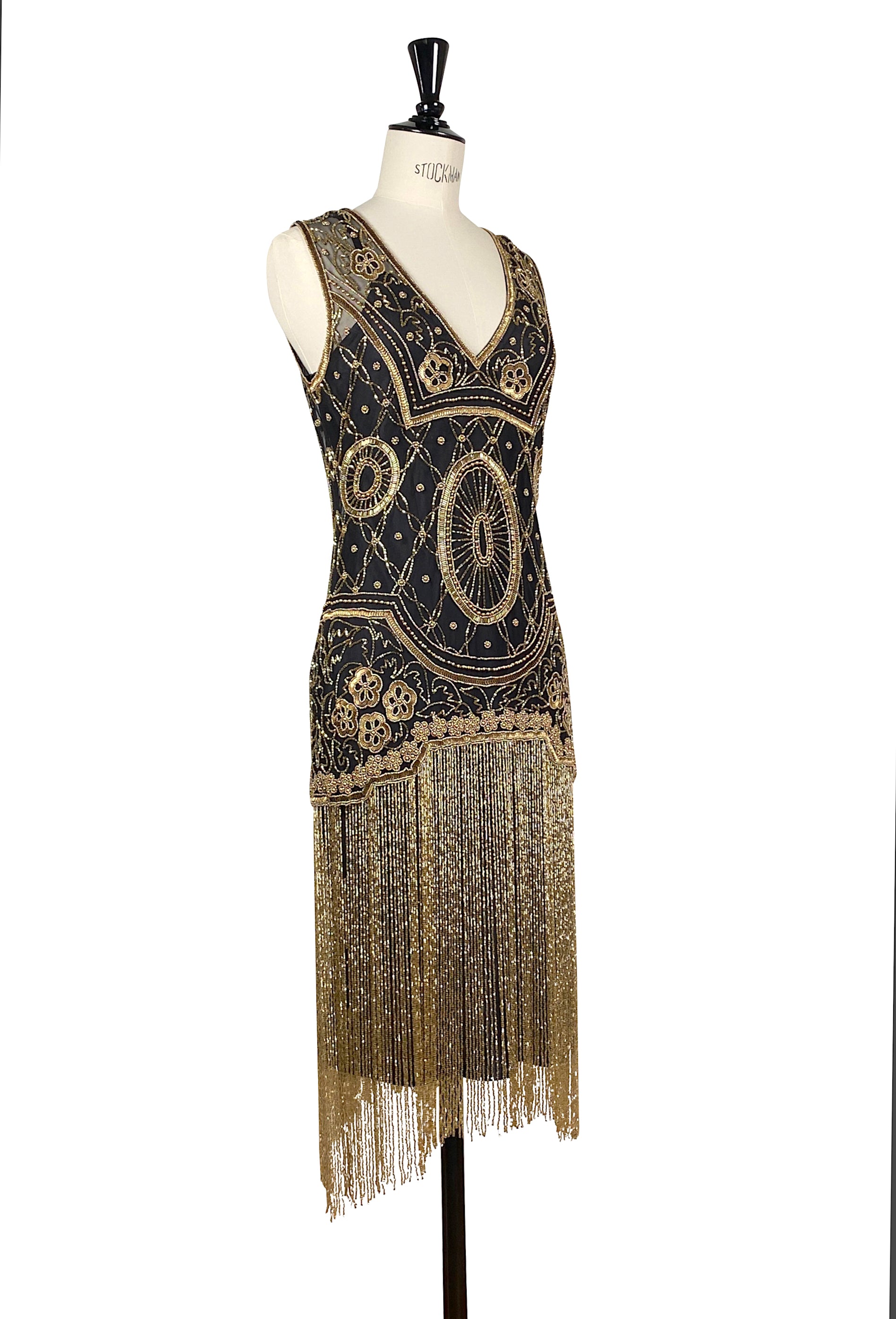 Sleeveless V-neck flapper dress with gold beading, decorative trim, and dangling fringe