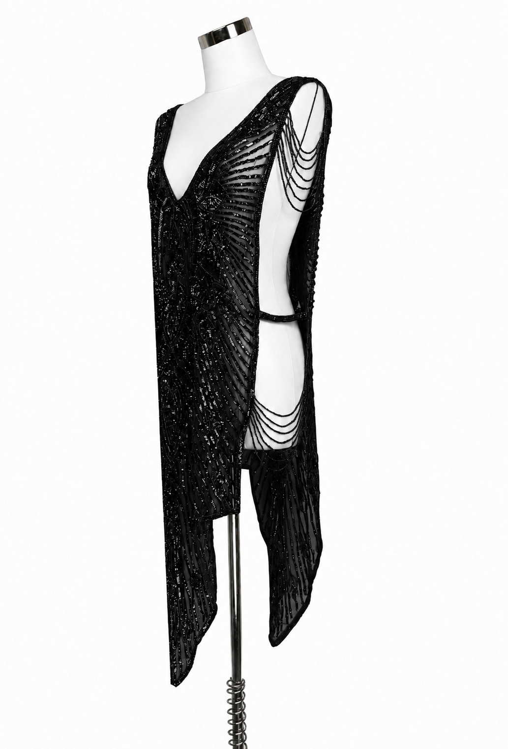 Black sequin overlay gown with one-shoulder drape and chain-like side chains