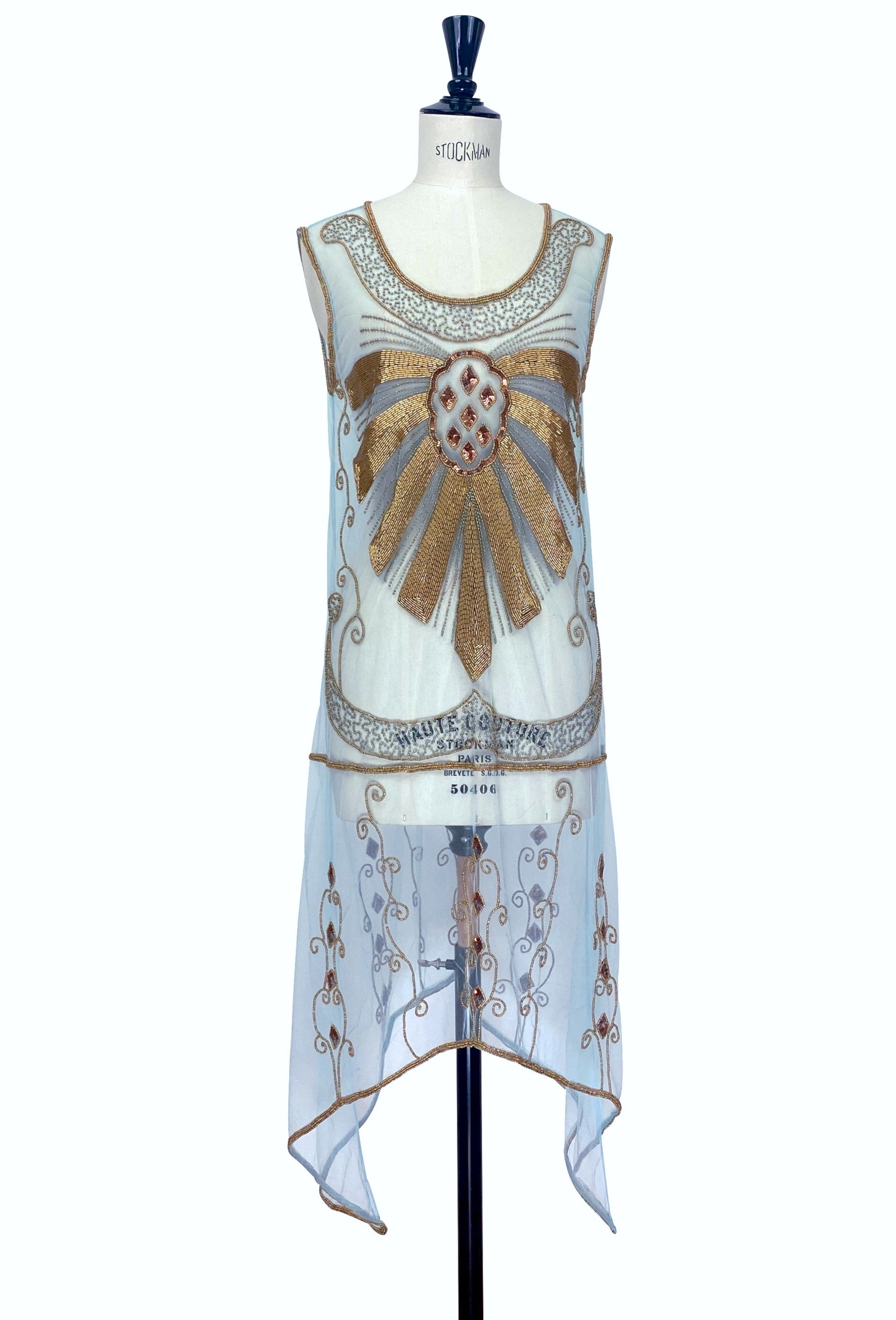 Sleeveless turquoise overlay dress with gold embroidered detailing and beaded neckline