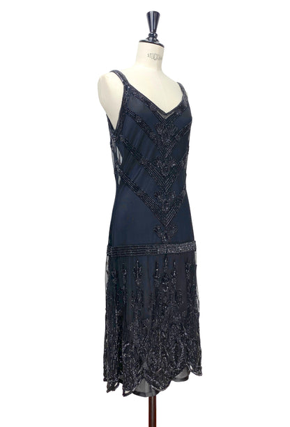 Sleeveless beaded slip dress with V-neck and geometric beading; scalloped fringe hem