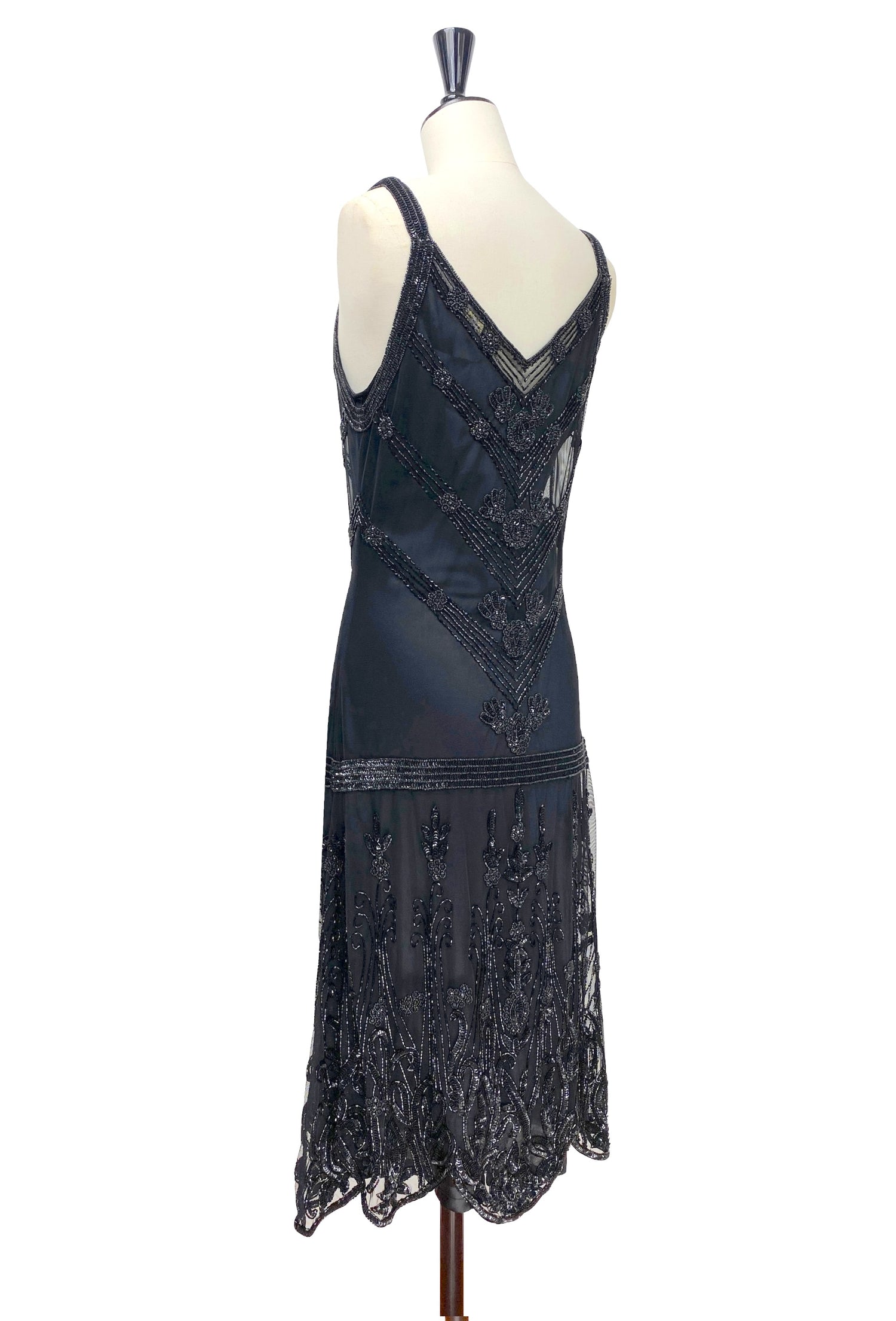 Sleeveless beaded slip dress with V-back and geometric beading; scalloped fringe hem