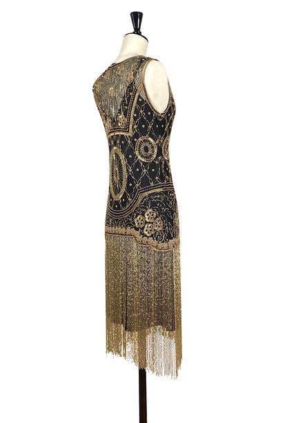 Sleeveless backless flapper dress with gold beaded detailing and long fringe hem