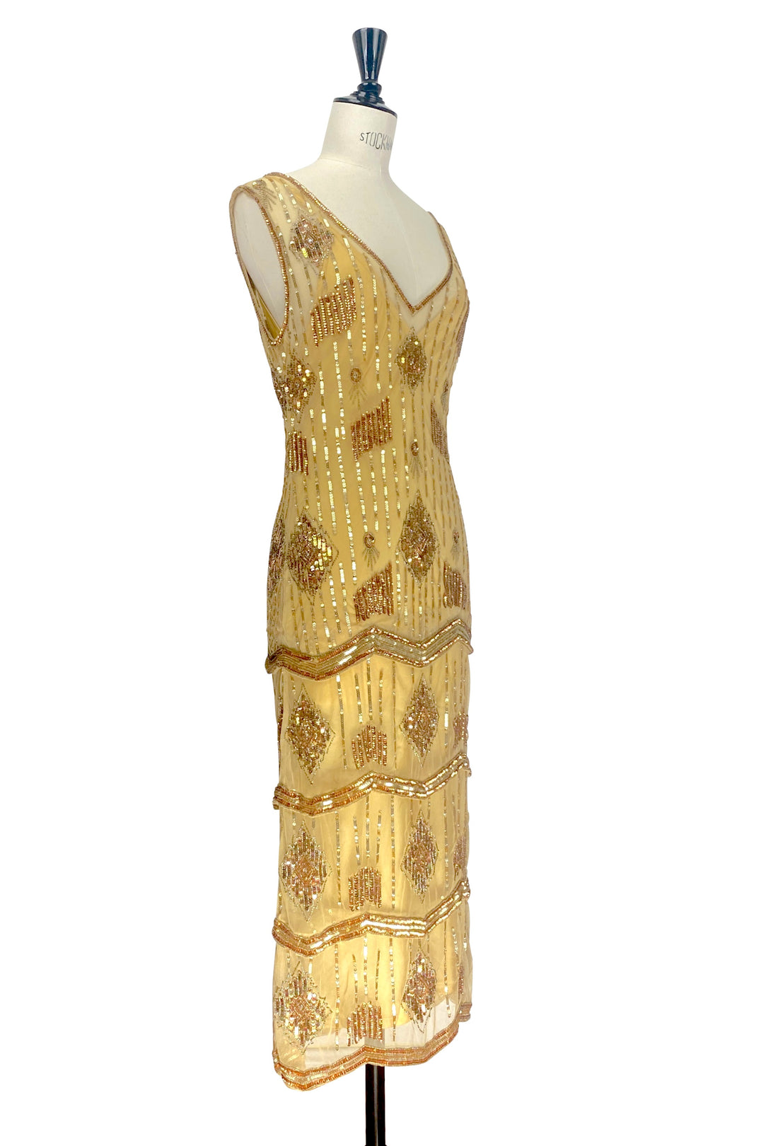 Gold art deco sequin sleeveless gown with V-neck and diagonal beaded stripes