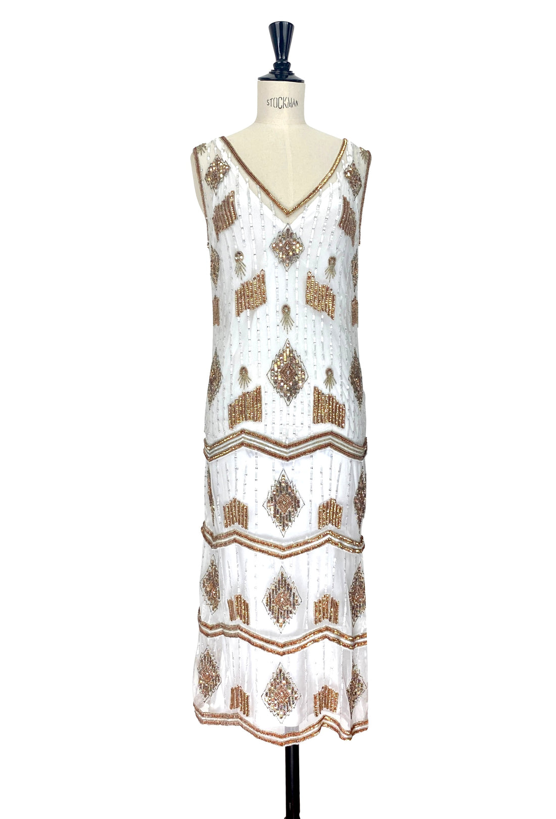 White art deco beaded gown with gold and brown geometric panels, V-neck and sleeveless