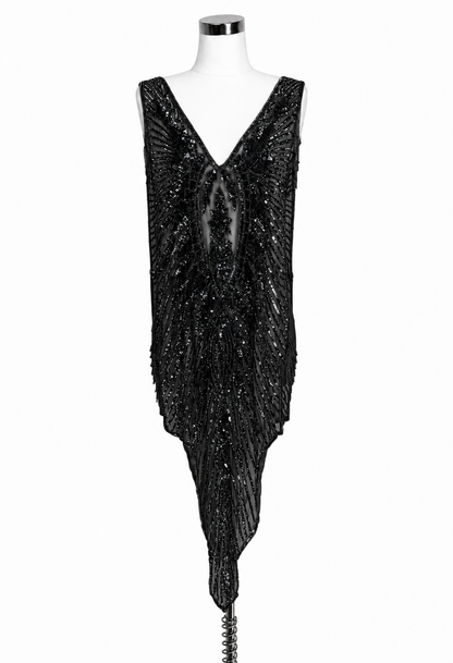 Black sequin overlay gown with deep V neckline and asymmetrical hem