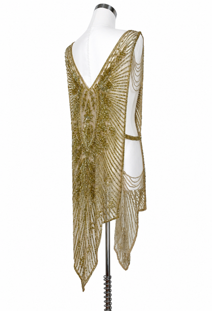 Gold sequin V-neck gown with back drape and hanging chain fringe detail