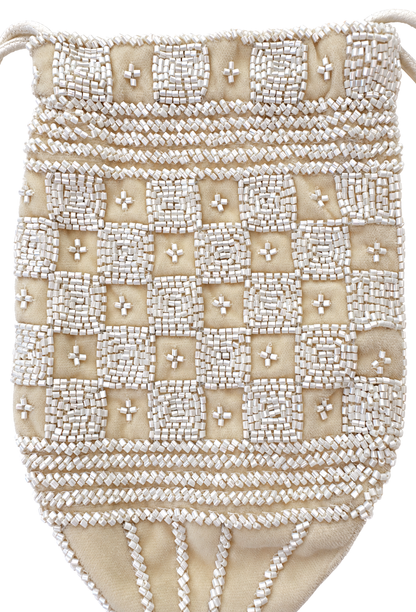 Cream beaded velvet pouch with cross-stitch pattern and braided trim