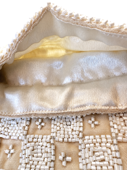 Cream satin lining and beaded trim of drawstring pouch