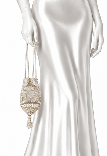 Cream beaded velvet pouch worn with long tassel drawstrings