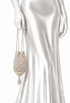 Cream beaded velvet pouch worn with long tassel drawstrings