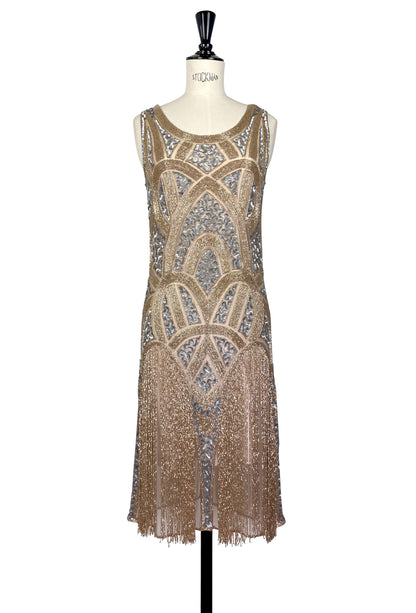 Vermeil beaded sleeveless evening gown with blue sequined motifs and fringe hem