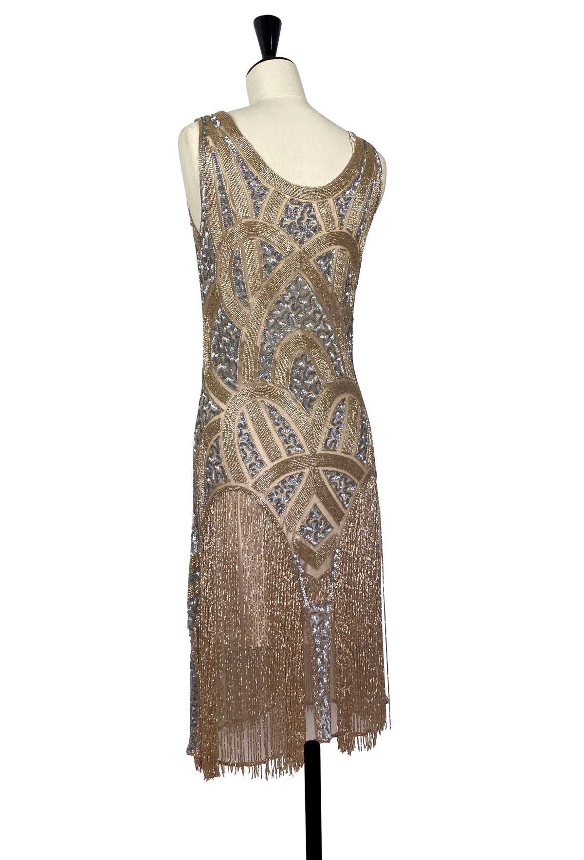 Beaded sleeveless gown with gold shimmer, blue geometric motifs, and fringe hem