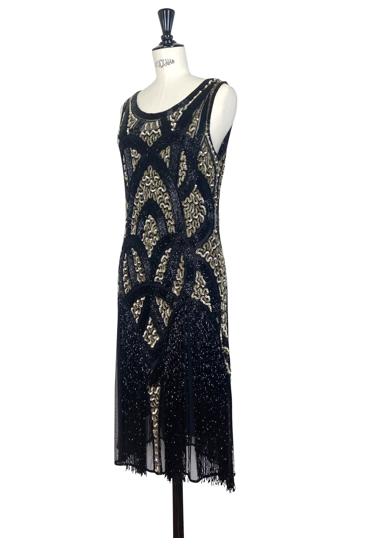 Black and gold beaded sleeveless shift dress with round neckline and fringe