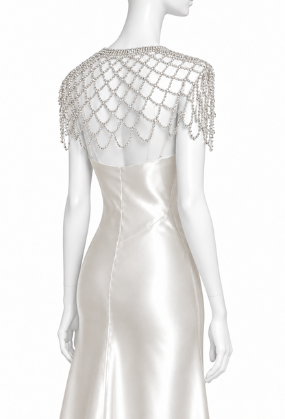 Silver rhinestone capelet with draped chain fringe over the shoulders