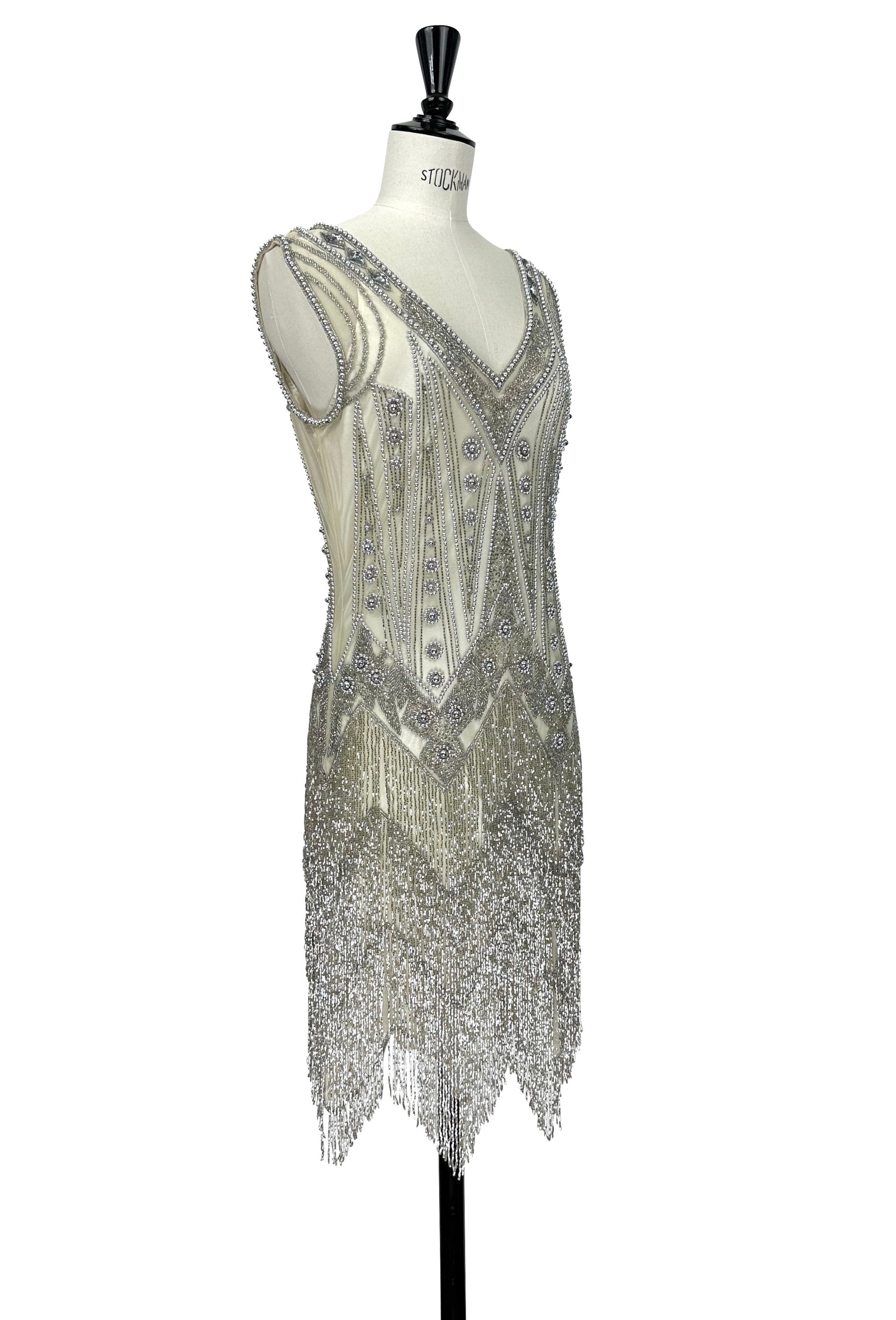 Beaded sleeveless V-neck gown in silver-gray with fringe hem detail