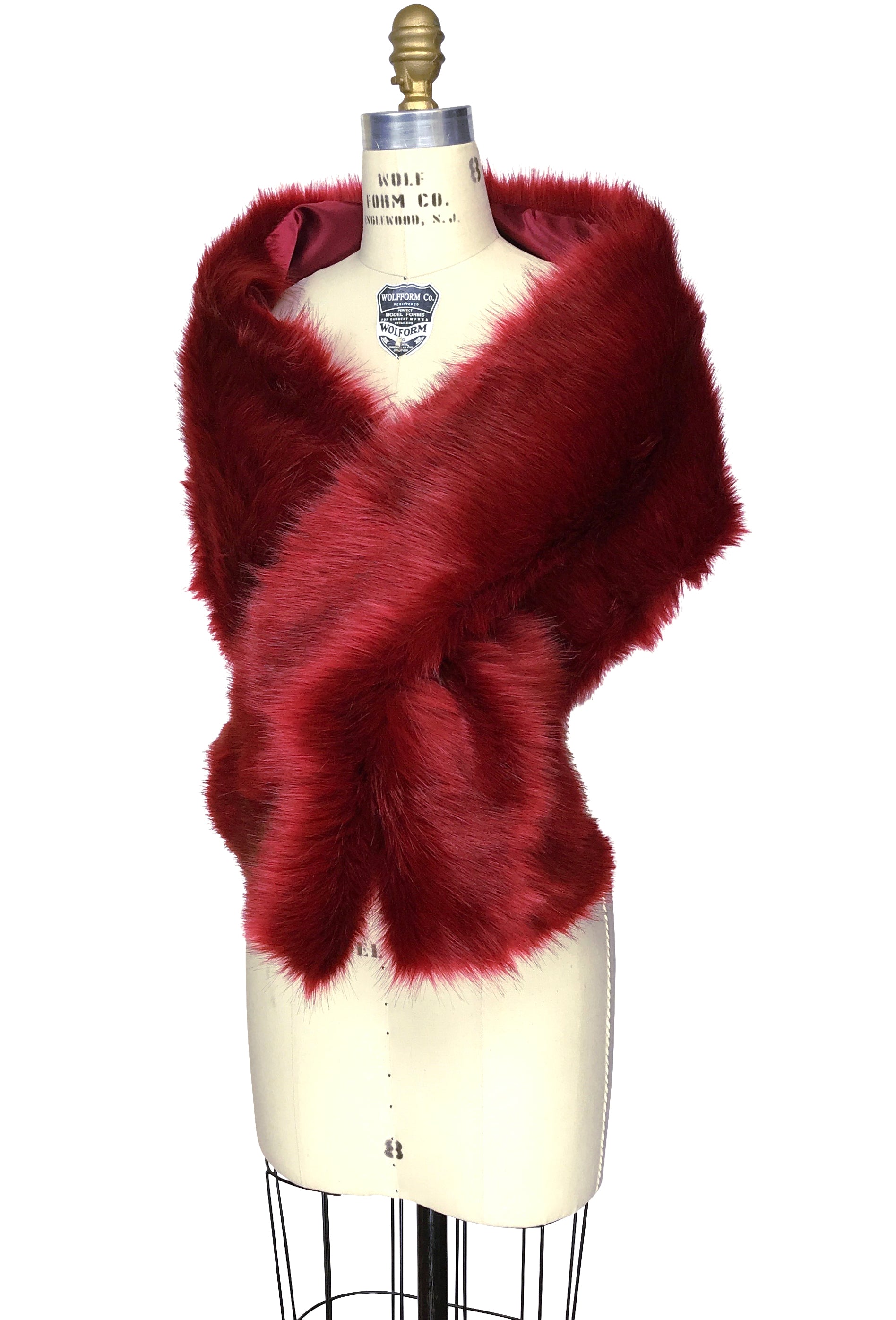 Garnet red faux fur stole with wide wrap and crossed front on mannequin