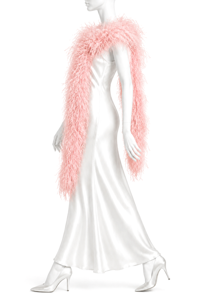 Rose pink ostrich-feather boa draped over shoulders and arms