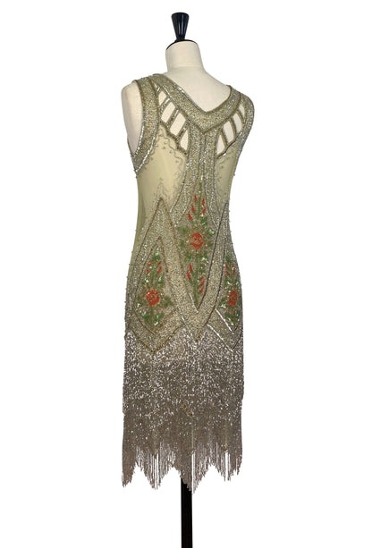 Icon gown Jardin back view, open back with crisscross straps, gold sequins and fringe hem
