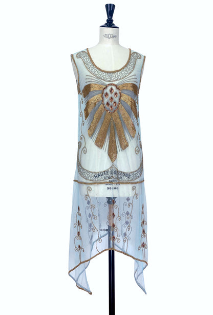 Sleeveless turquoise overlay dress with gold embroidered detailing and beaded neckline