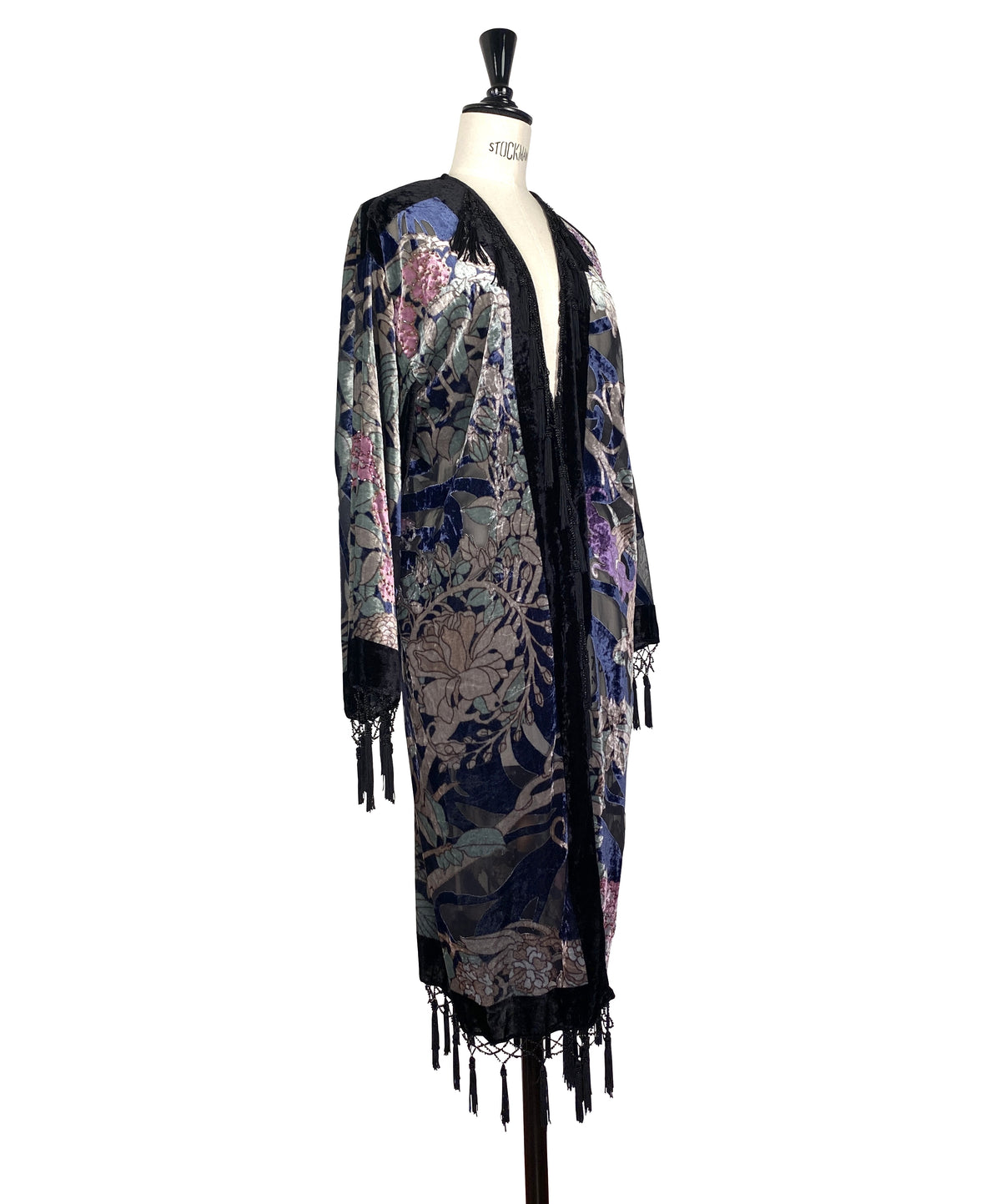 Long velvet kimono with open front, dark trim, multicolor illustrated panels, fringe