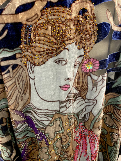 Close-up velvet kimono panel with jeweled face illustration, beads, sequins, fringe
