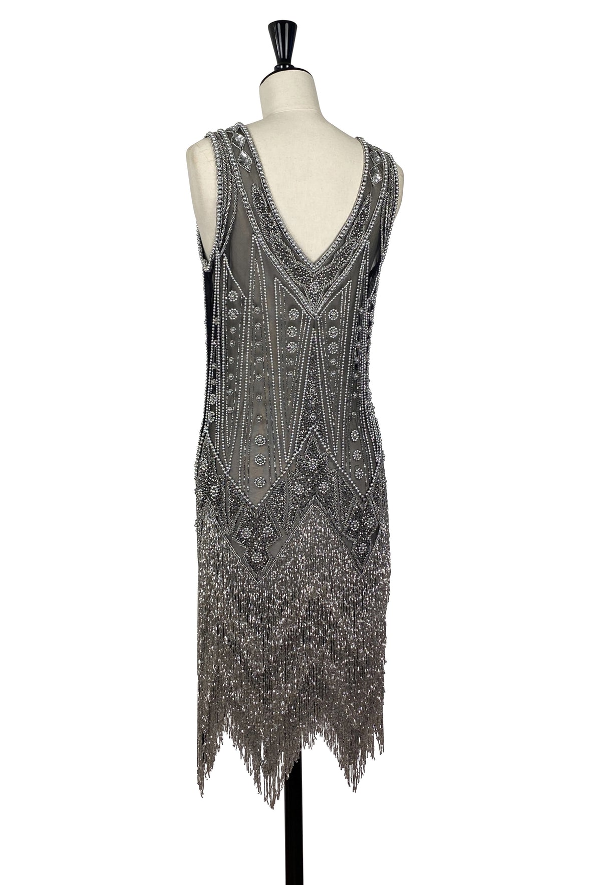 Silver-toned beaded sheath dress with V-neck, intricate patterns, and long fringe hem.