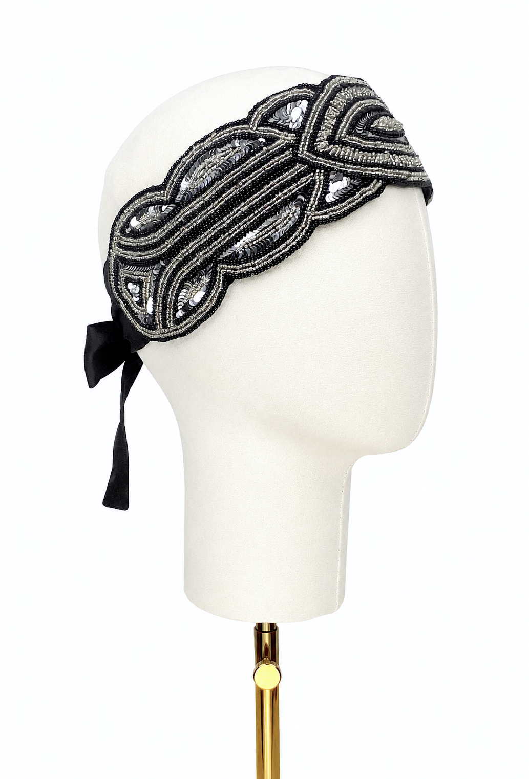 Noir silk bandeau headband with ornate black-and-silver embroidery and ribbon tie