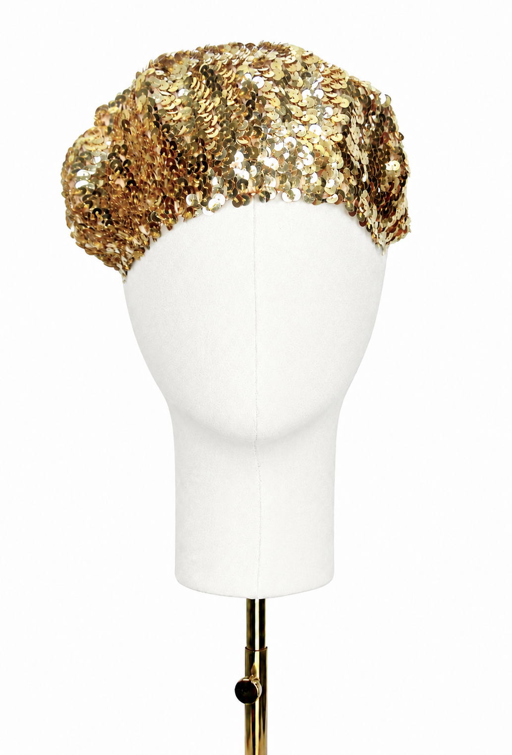 Gold sequin beret with rounded crown and scalloped brim on mannequin