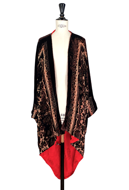 Silk velvet cocoon jacket with ornate brown-and-gold panels and crimson drape
