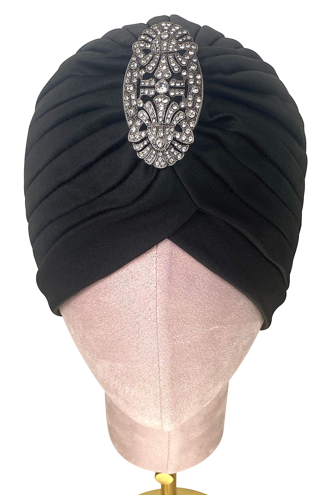 Black evening turban with ornate silver filigree brooch and quilted pleat detailing