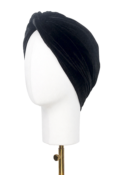 Black velvet draped turban with wide diagonal wrap on mannequin