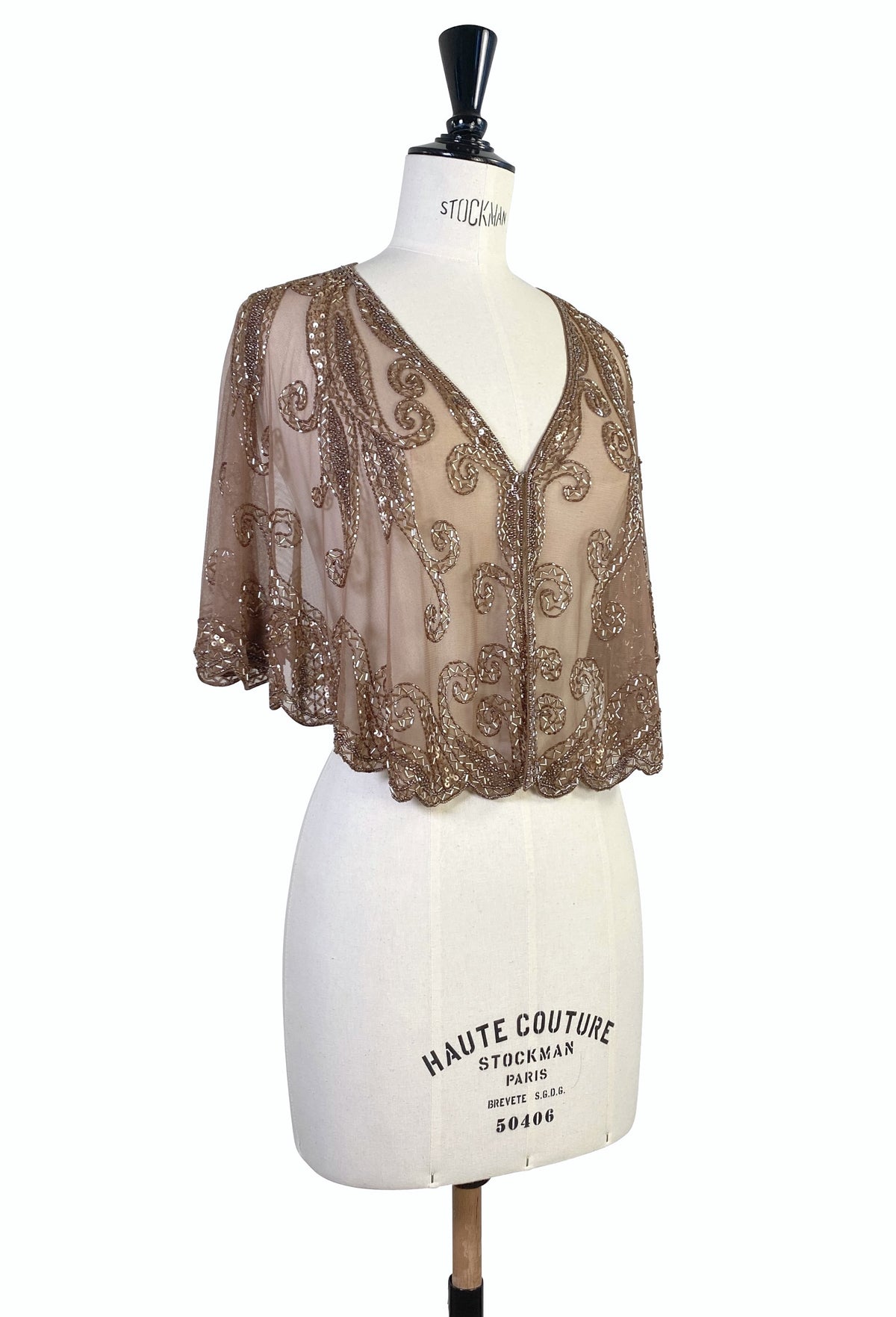 Antique bronze sheer capelet with ornate scroll embroidery, V-neck and flared sleeves