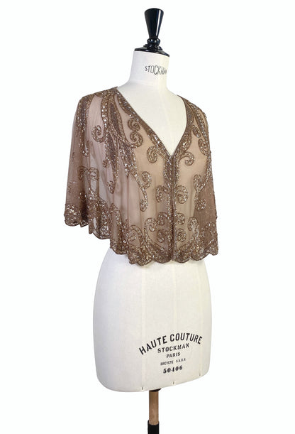 Antique bronze sheer capelet with ornate scroll embroidery, V-neck and flared sleeves