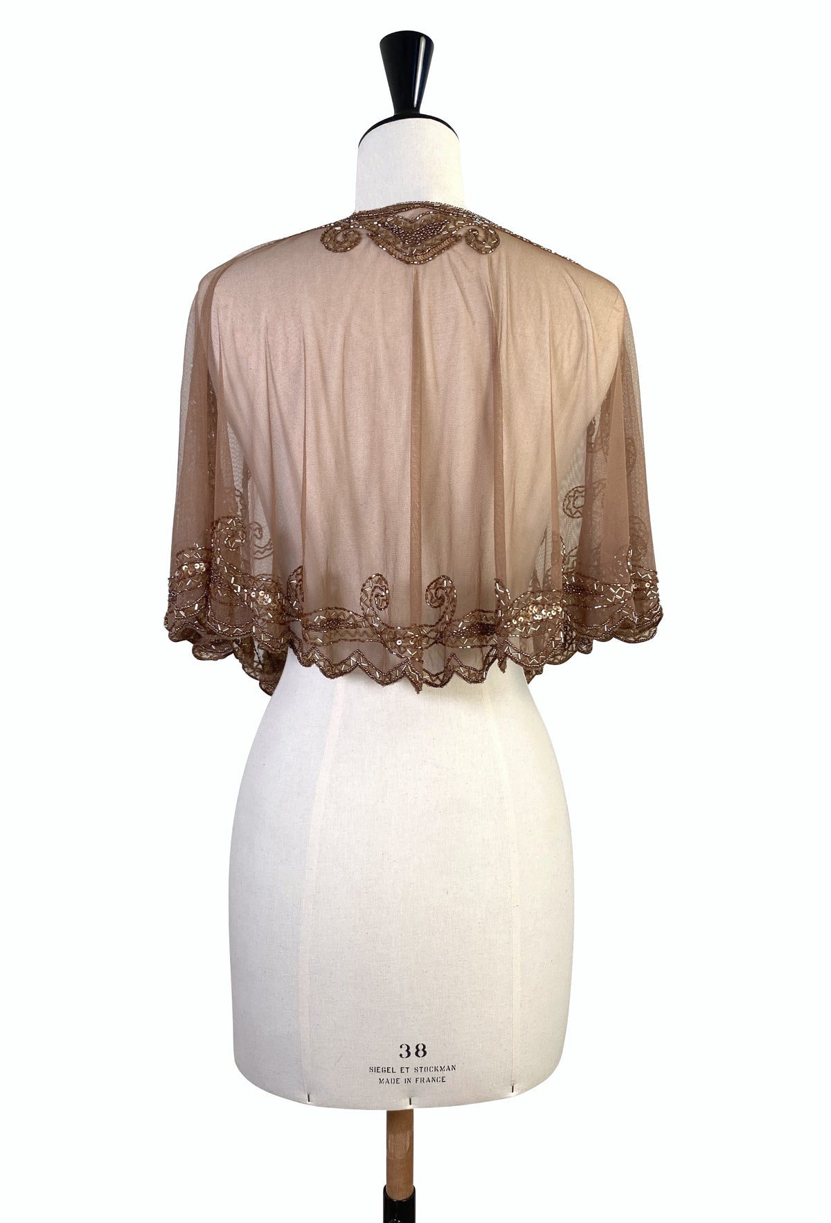 Antique bronze capelet back view with scroll embroidery and scalloped edge