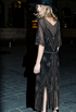 Dark satin evening dress with gold embroidery, V-back, short sleeves, slit hem