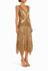 Gold sequin gown with ruffled cap sleeves, deep V front, and asymmetrical fringe hem