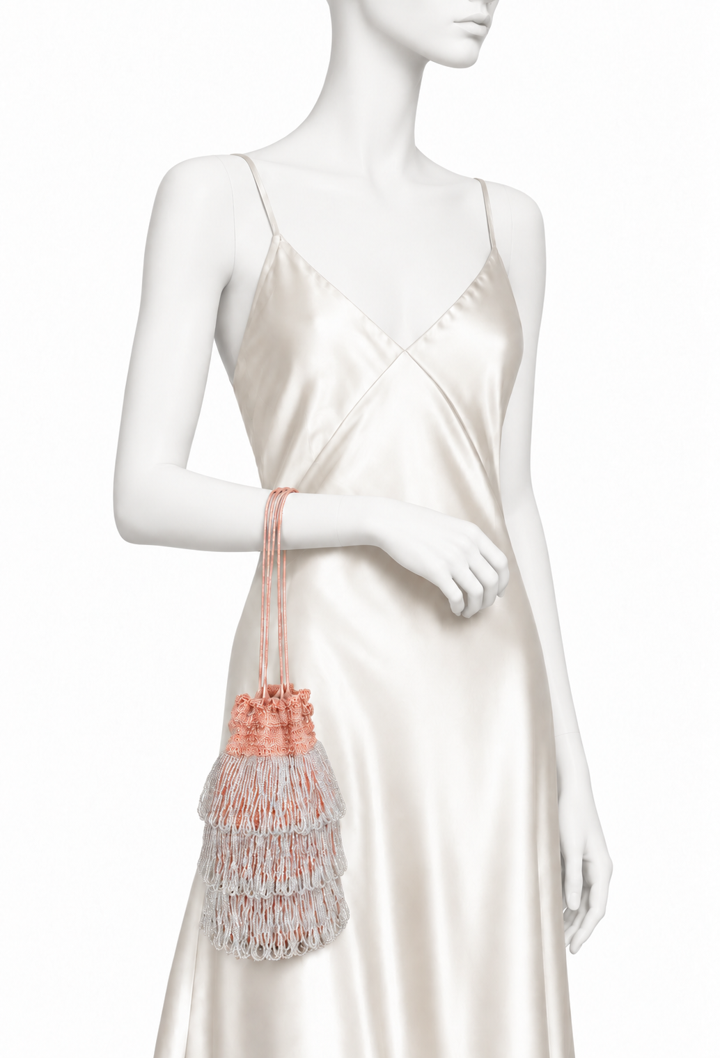 Beaded drawstring pochette bag in pink tones with tassel-style cords
