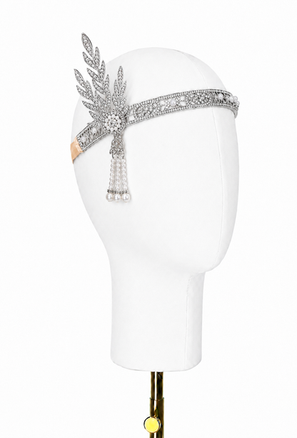 Silver art deco tiara with leaf-like filigree, rhinestones, and hanging pearl drops