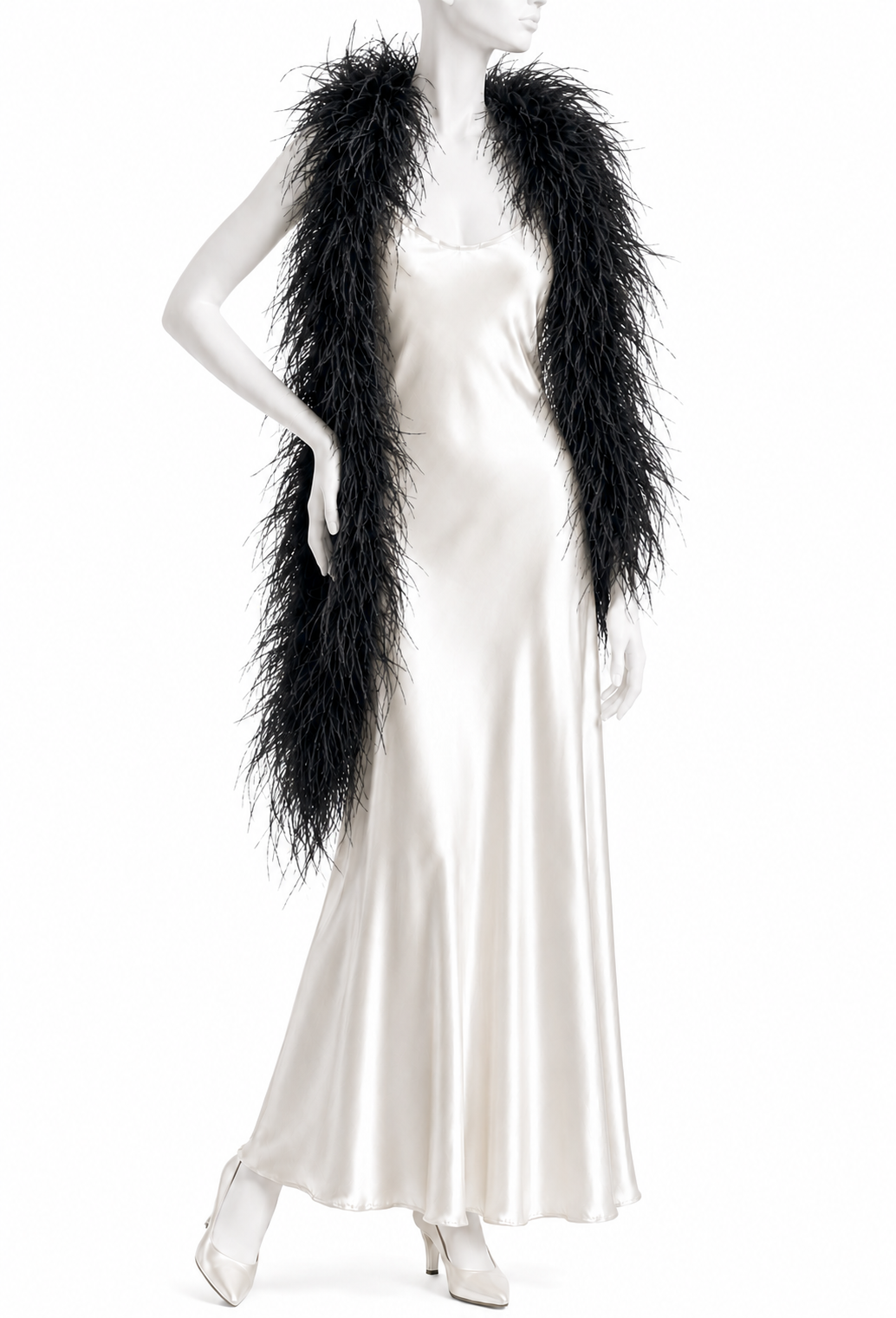 Black ostrich feather boa with long fluffy fringe, worn over a satin slip dress