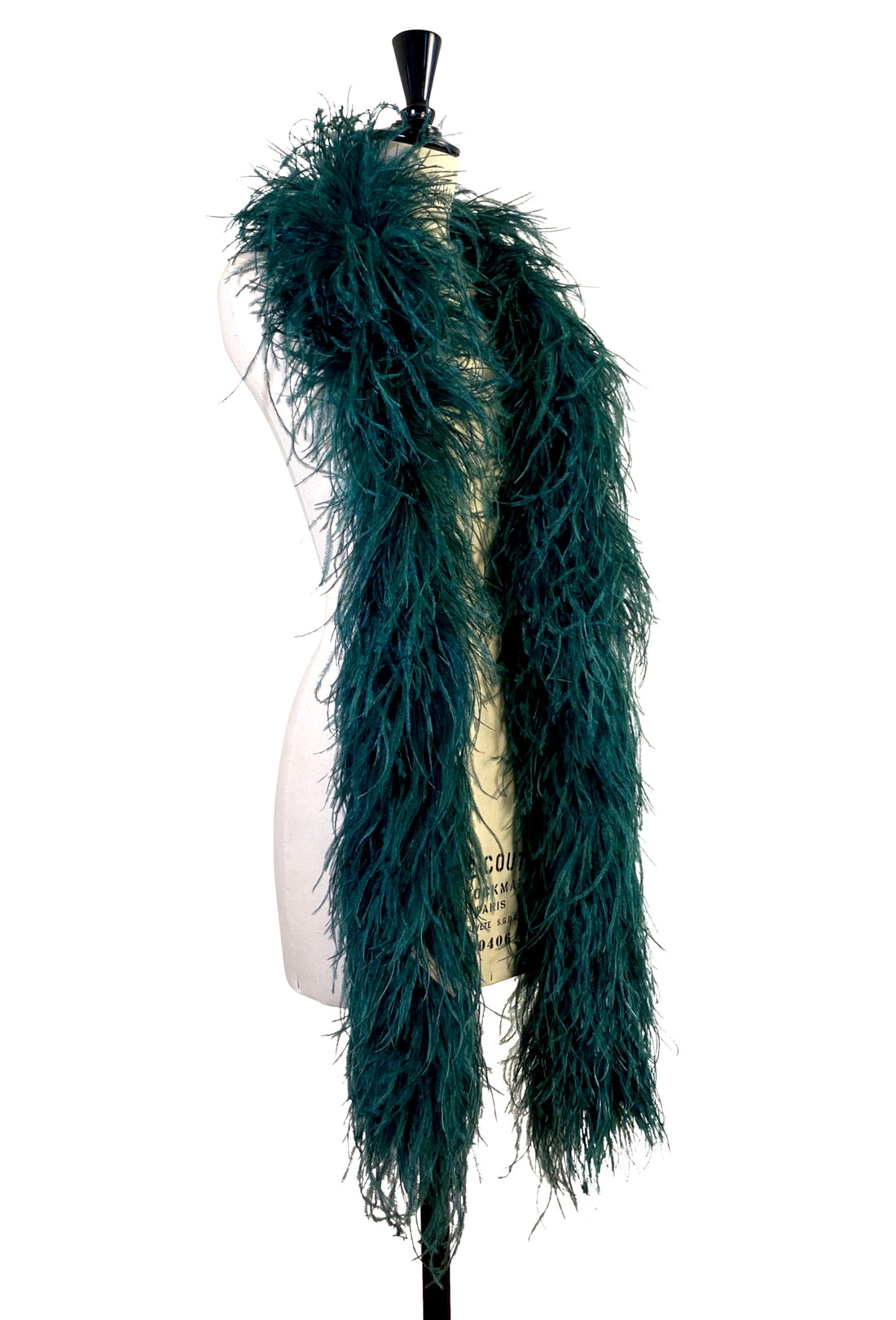 Teal-green ostrich feather boa stole with long shaggy fringe, draped down the back