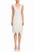 Sleeveless cream beaded gown with V-neck and fringe hem