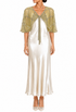 Gold sheer capelet with short sleeves, embroidered trim, and tie at center neckline