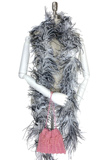 Pink knit drawstring mini pouch with braided cord drawstring and tassel