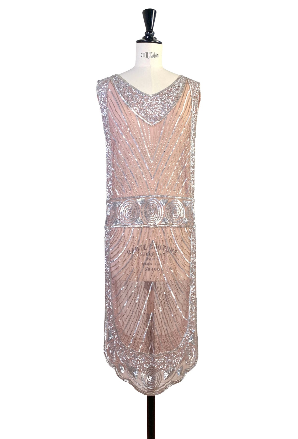 Rose-pink sleeveless tabard dress with V-neck and ornate circular beaded border
