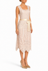 Pale peach sleeveless lace sheath dress with ribbon waist tie and scalloped hem