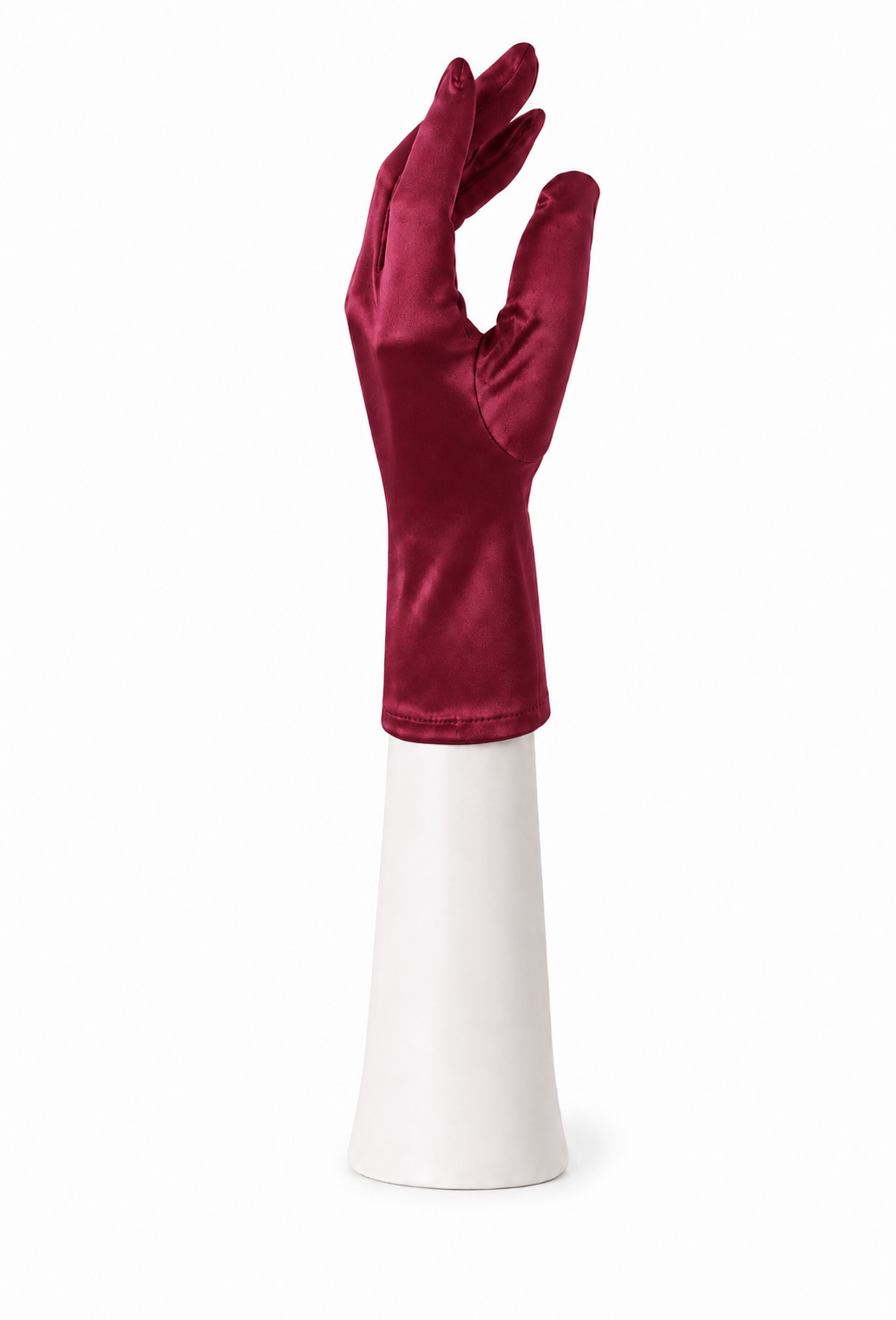 Burgundy satin tea glove, fitted long cuff, hand shape on white stand.