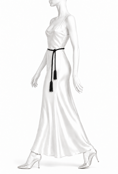 Black tassel lariat belt worn at the waist with long cord ties