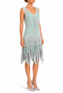 Mint green sleeveless beaded mini dress with V-neck, scalloped trim, and fringe