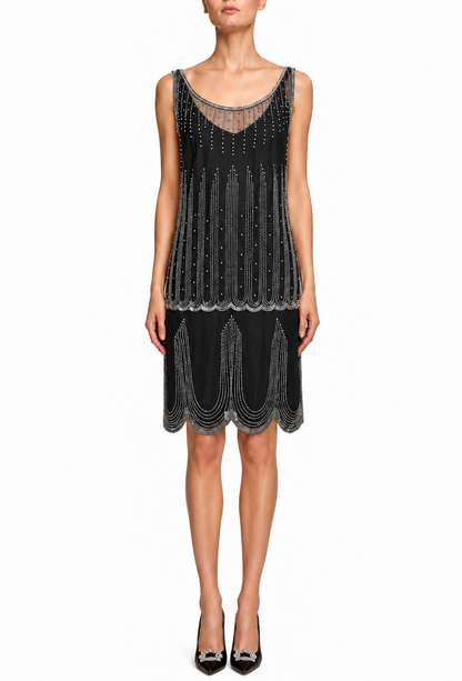 Black sleeveless cocktail dress with beadwork stripes, V neckline, and layered fringe